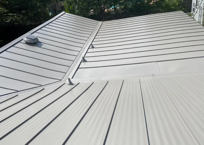 Solar attic fan installed on a metal roof for Roof Ventilation in Kennesaw